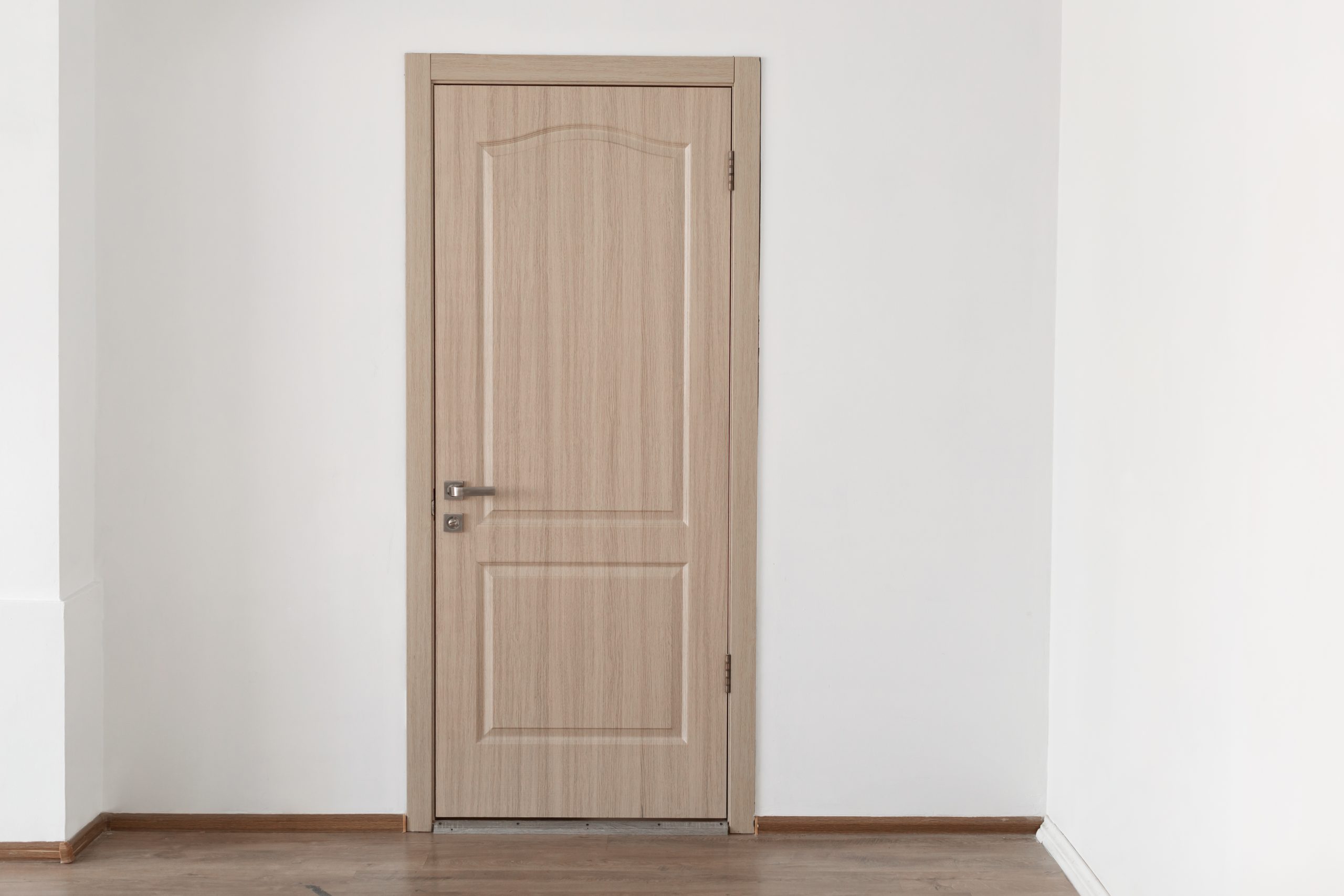 Closed Wooden Door on Whie Wall, New Aprtment