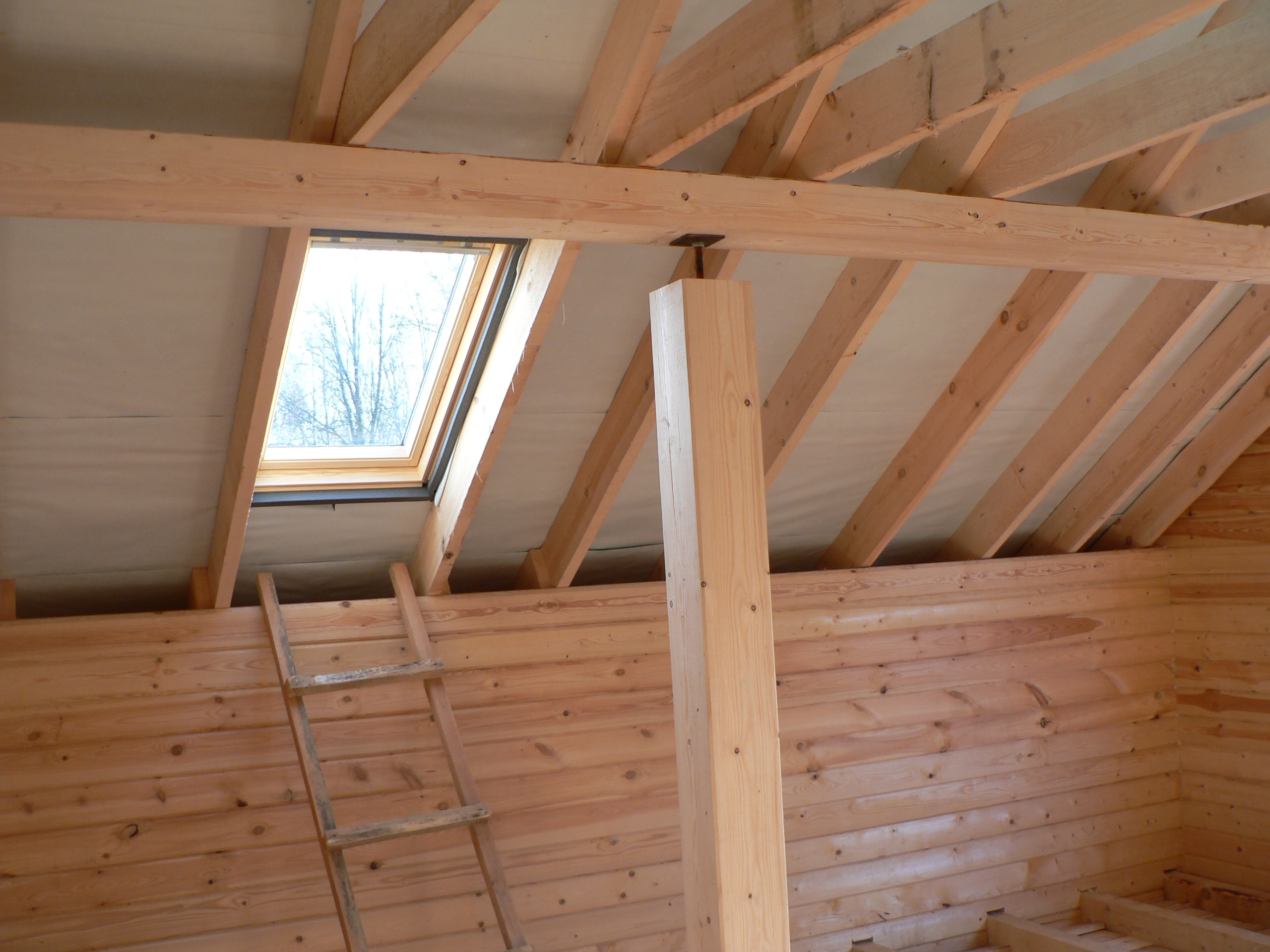 construction-of-a-wooden-house-roof-view-with-win-2025-03-10-14-35-42-utc